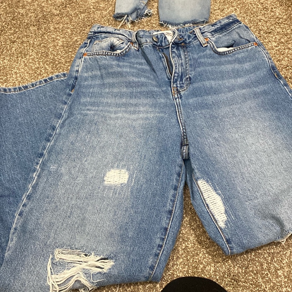 Distressed baggy blue jeans